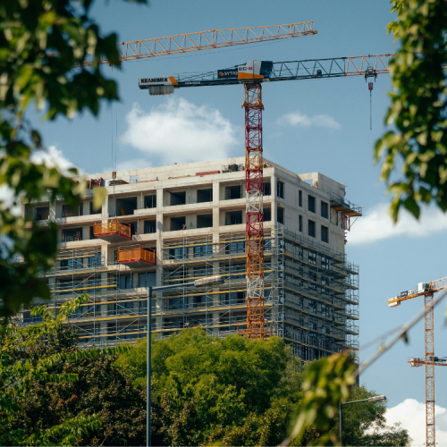 Building under construction with trees